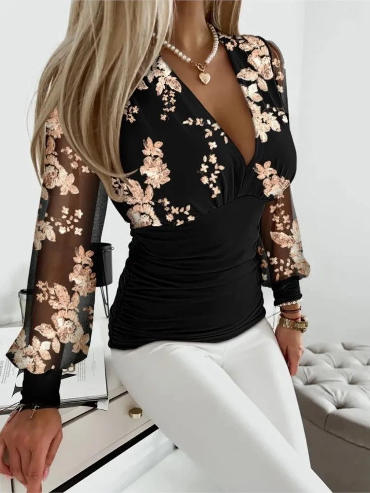 Blusa feminina sofisticada, perfeita para o outono. Possui decote em V profundo, cintura ajustada e mangas