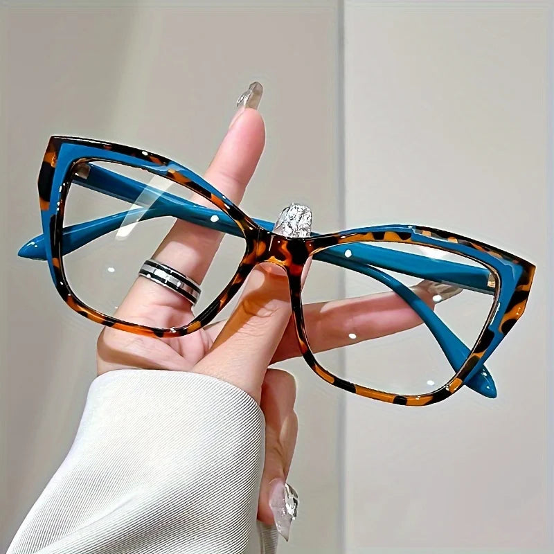 Óculos de leitura femininos com design elegante “cat eye” e bloco de cores moderno. Protege contra luz azul, ideal para uso prolongado em frente a telas de computador e dispositivos móveis.