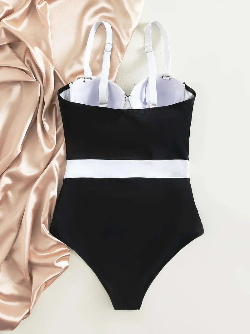 Maiô feminino elegante e sensual, com bojo push-up e design colorblock moderno. Possui sustentação por aro, valorizando o busto e garantindo conforto durante o uso. Ideal para piscina, praia ou férias de verão.