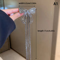 Presilha delicada para mulheres, com design em laço, tassel elegante e strass brilhante. Ideal para complementar penteados em festas, eventos ou looks do dia a dia, adicionando um toque sofisticado e feminino.