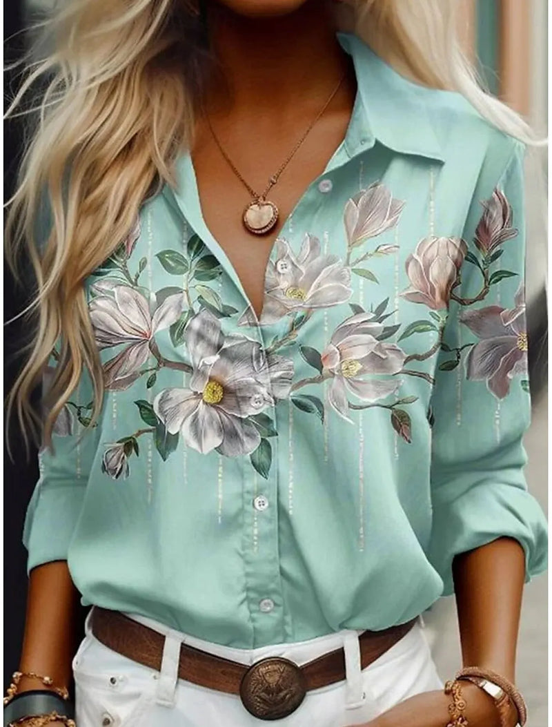 Blusa Feminina de Verão com Estampa Floral – Gola Lapela e Manga Longa  Design feminino com estampa de flores delicadas  Gola com lapela, adicionando toque clássico e elegante  Manga longa, ideal para proteção solar leve e estilo casual