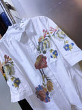 Adicione um toque delicado e elegante ao seu guarda-roupa com esta blusa feminina bordada com flores. Confeccionada em 100% algodão puro, é leve, respirável e confortável, perfeita para o verão.