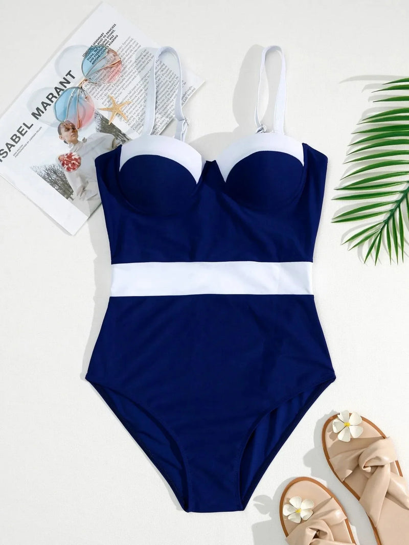 Maiô feminino elegante e sensual, com bojo push-up e design colorblock moderno. Possui sustentação por aro, valorizando o busto e garantindo conforto durante o uso. Ideal para piscina, praia ou férias de verão.