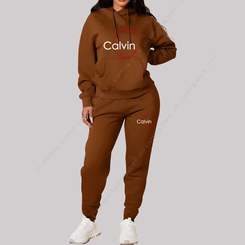 Eleve seu estilo casual com este conjunto feminino 2 peças 2026, composto por hoodie de capuz confortável e calça de moletom de alta qualidade.
