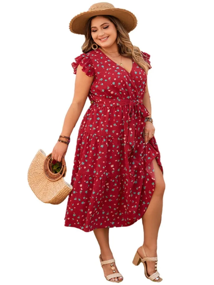 Vestido midi feminino, solto e confortável, com decote em V e sem mangas. Apresenta estampa floral delicada, babados e pregas que adicionam charme e movimento. Ideal para looks casuais de verão