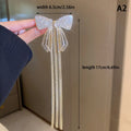 Grampo de Cabelo Feminino 2026 – Laço com Tassel e Strass