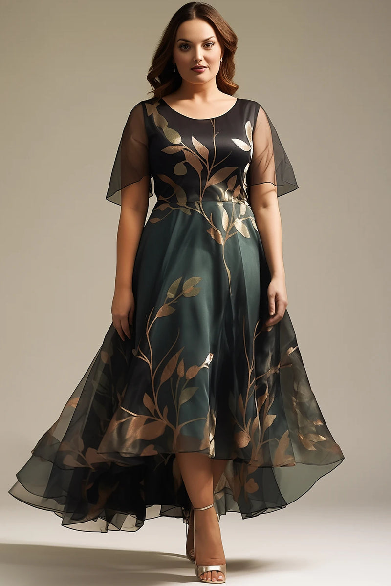Vestido maxi feminino elegante em organza preta com estampa floral delicada. Estilo A-linha com mangas fluídas  e barra assimétrica , oferecendo movimento e sofisticação