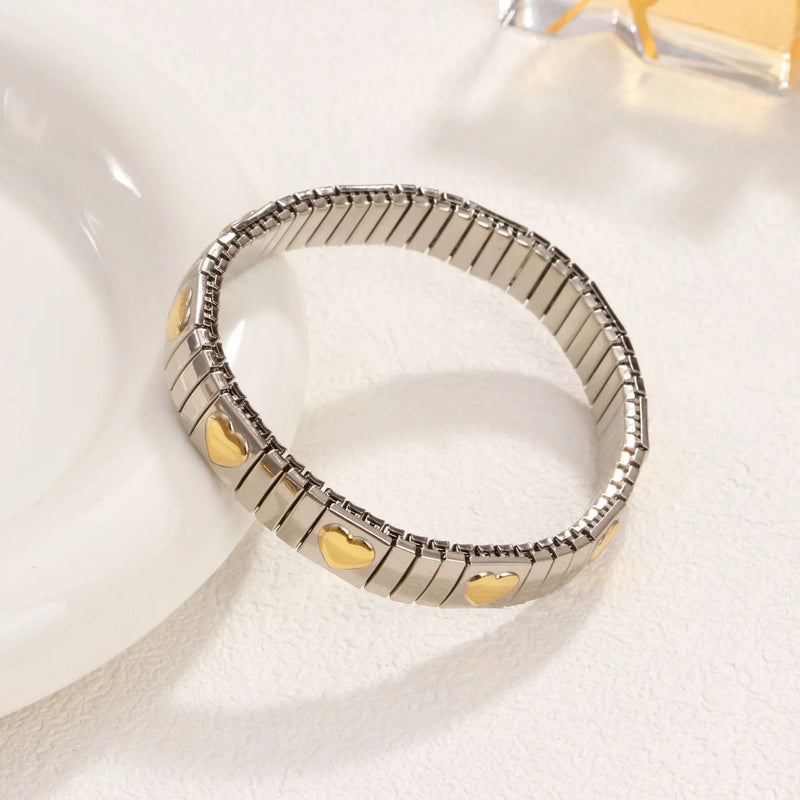 Pulseira Feminina de Aço Titânio com Coração – Design Elástico, Banhada a Ouro