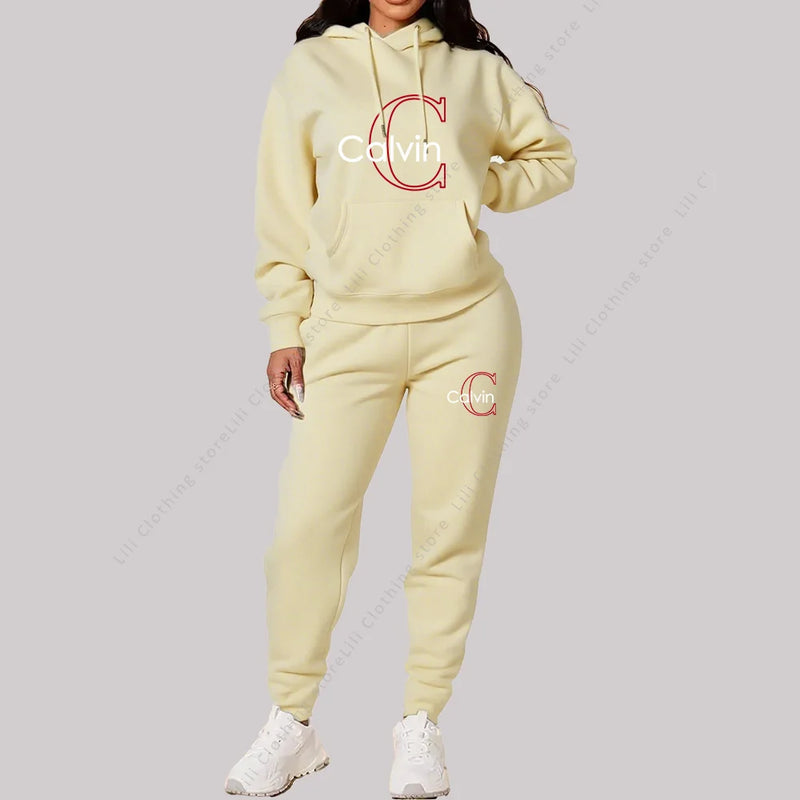 Eleve seu estilo casual com este conjunto feminino 2 peças 2026, composto por hoodie de capuz confortável e calça de moletom de alta qualidade.