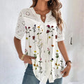 Blusa feminina de renda com mangas curtas, estilo solto e sofisticado. Perfeita para ocasiões casuais, fins de semana ou férias, combinando conforto e elegância em um look moderno.